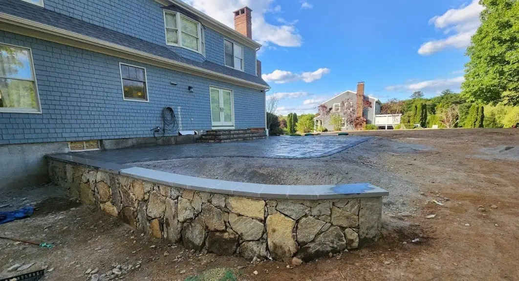 Patio installation in progress — pavers being laid at Johnston, RI property