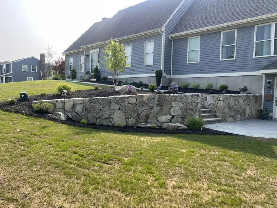 Stone retaining wall, patio and landscaping installation in Johnston, Rhode Island